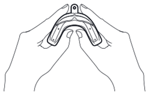 Hands spreading the frame of the mouth guard